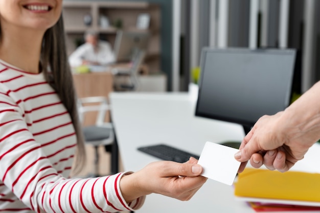 Smiley Woman Holding Blank Business Card