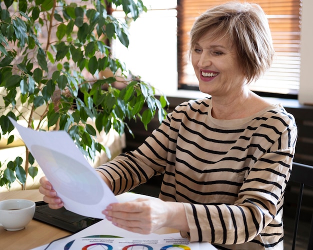 Smiley woman holding color palette