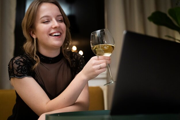 Smiley woman holding drink medium shot