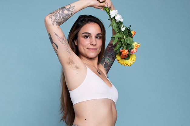 smiley woman holding flowers medium shot
