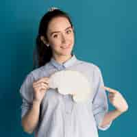 Free photo smiley woman holding paper brain