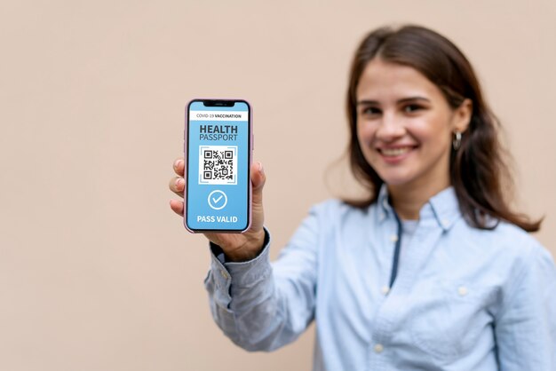 Smiley woman holding phone medium shot