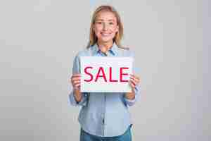 Free photo smiley woman holding sale sign