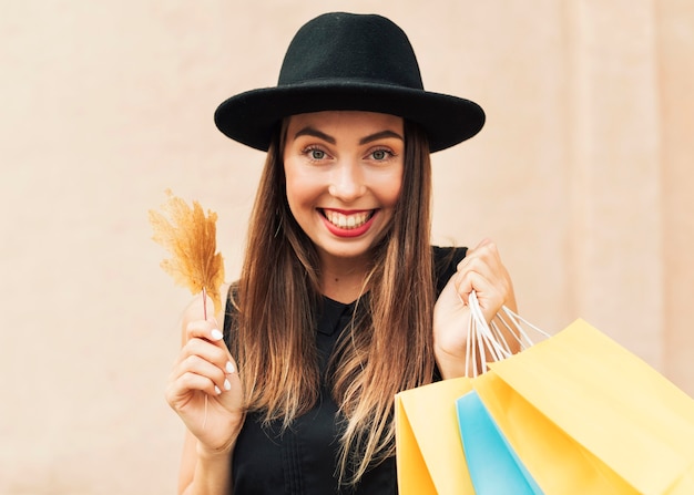 Smiley woman holding shopping bags