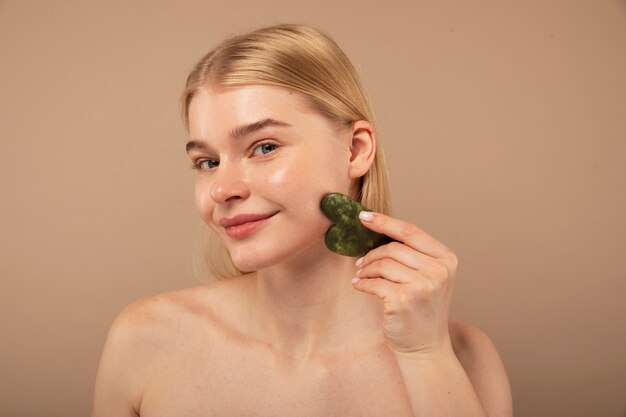 Smiley woman holding tool close up