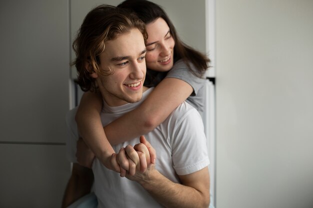 Smiley woman hugging boyfriend