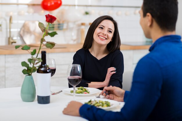 Smiley woman looking at her boyfriend