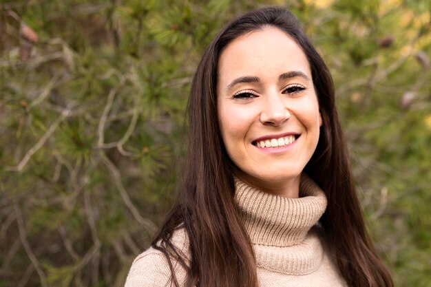 Smiley woman posing outdoors in nature