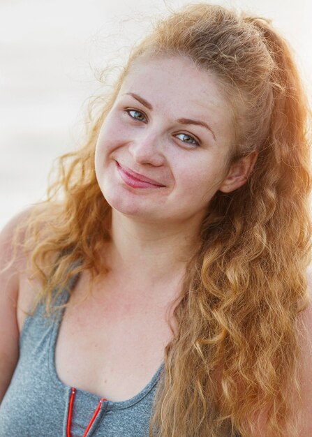 Smiley woman posing outdoors