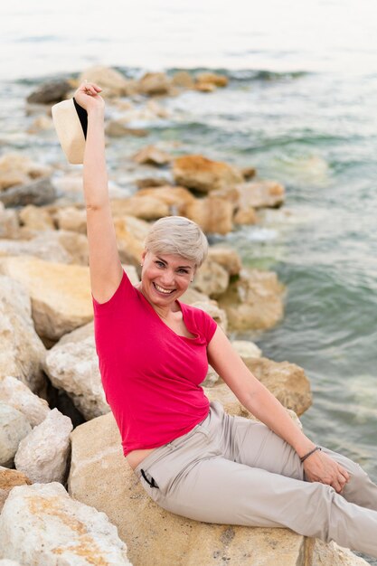 Smiley woman posing at sea