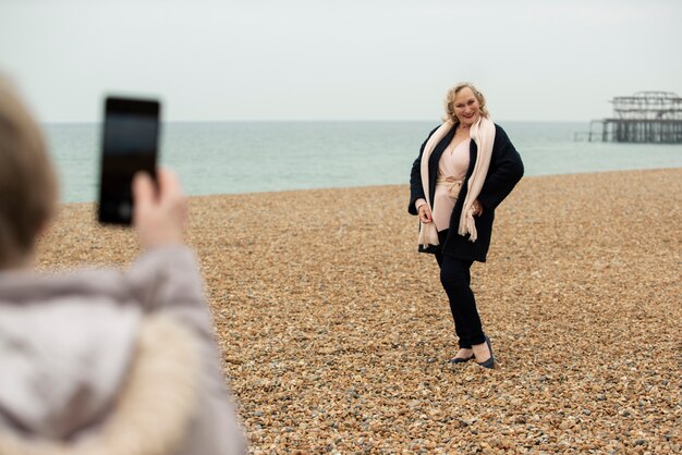 Smiley woman posing at seaside