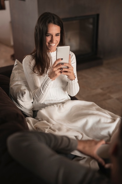 Smiley woman taking photos of boyfriend