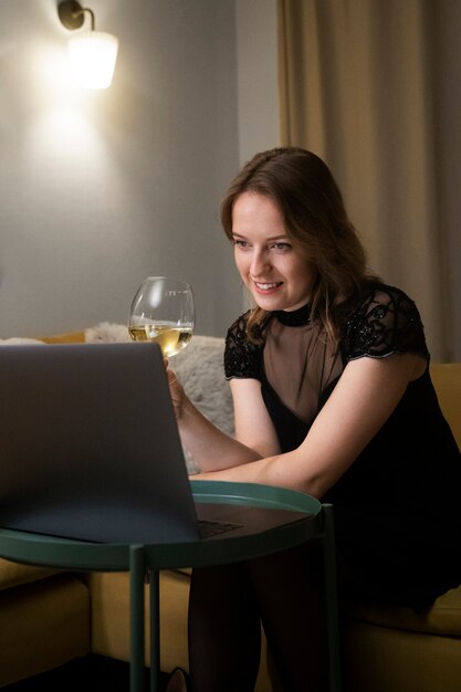 Smiley woman on virtual date medium shot