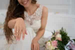 Free photo smiley woman wearing engagement ring