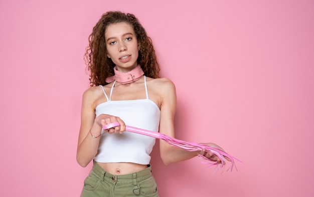 Smiley woman wearing pink chocker medium shot