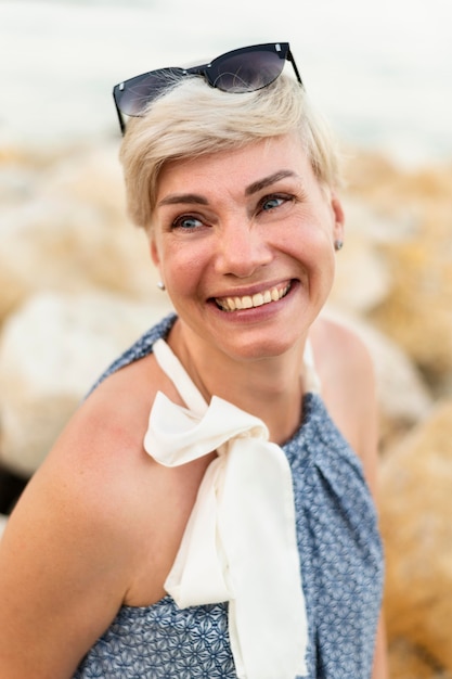 Smiley woman wearing sunglasses