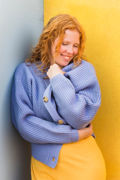 Free photo smiley woman wearing sweater