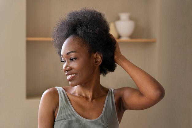 Smiley woman with afro hair medium shot