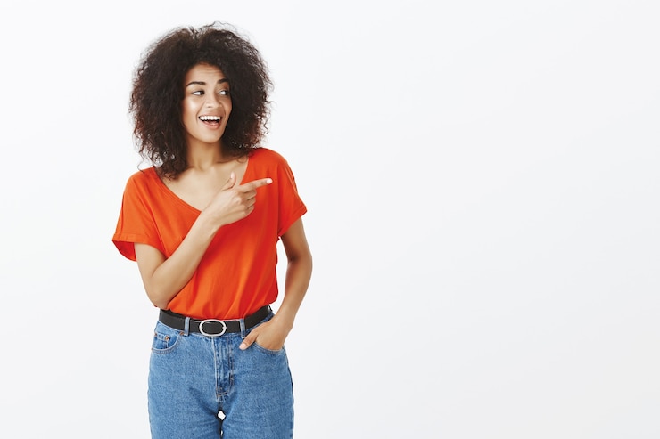 Free Photo smiley woman with afro hairstyle posing in the studio