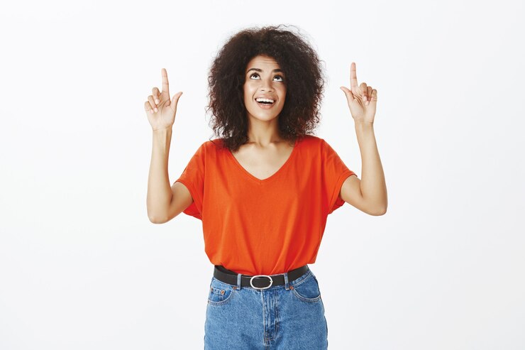 Free Photo smiley woman with afro hairstyle posing in the studio