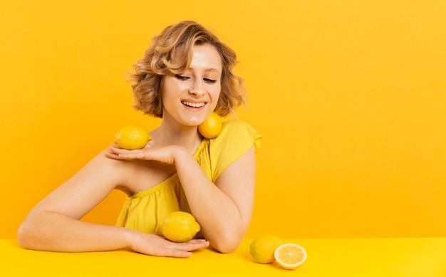 Smiley woman with lemons on her body