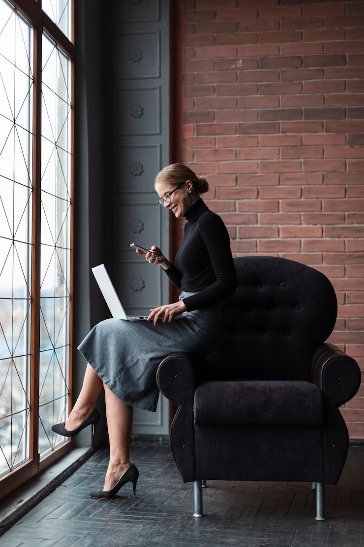 Free Photo smiley woman with phone and laptop