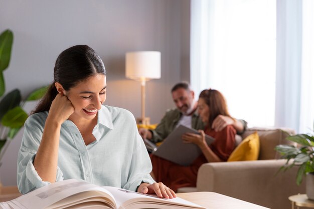 Smiley woman with picture album front view