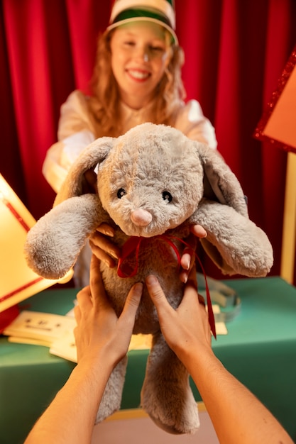 Free photo smiley woman with toy front view