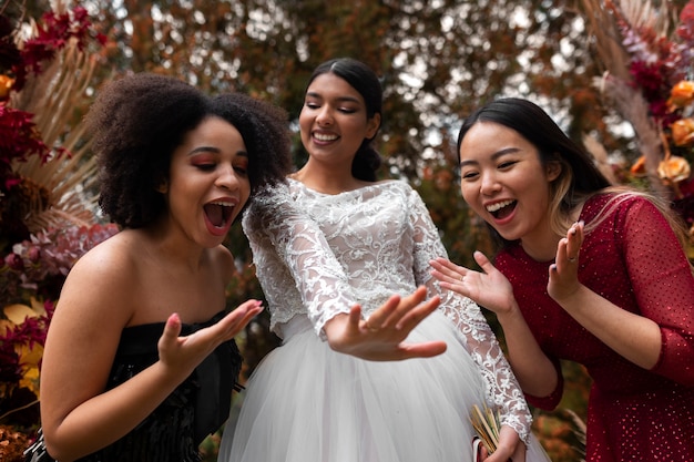 Smiley women posing together front view