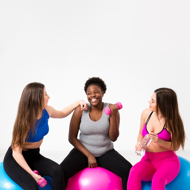 Smiley women working out together