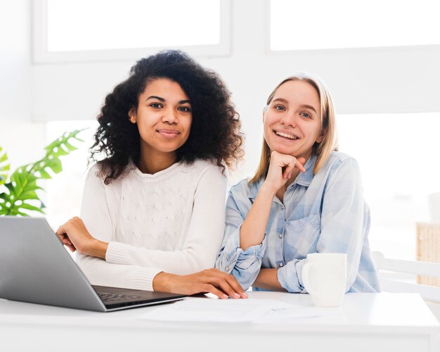 Smiley womens looking at camera