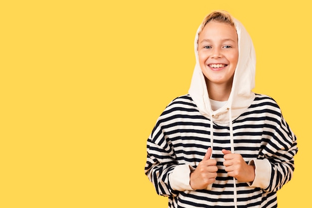Smiley young boy wearing hoodie