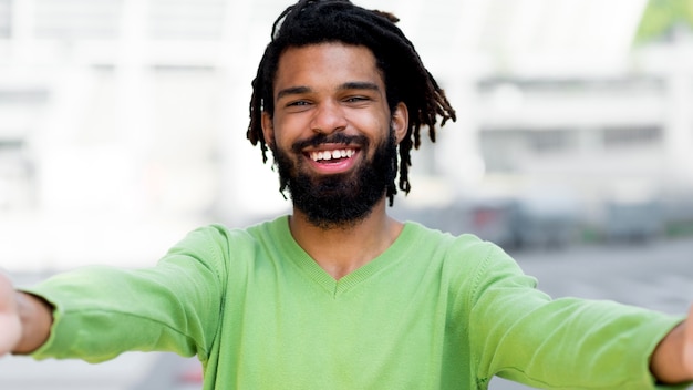 Free photo smiley young person ready to give a hug