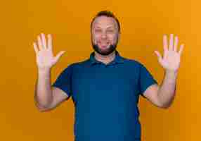 Free photo smiling adult slavic man showing empty hands