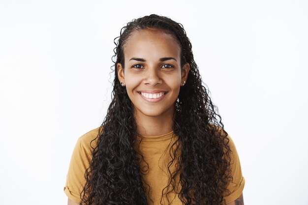 Smiling African-American girl in brown Tshirt