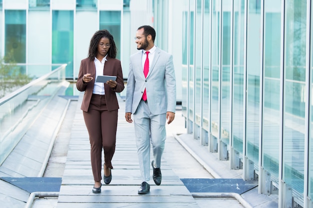 Smiling African American man listening colleague