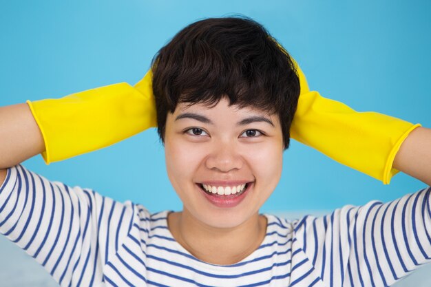 Smiling Asian Woman Wearing Protective Gloves