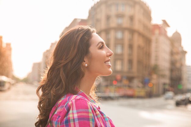 Smiling attractive girl looking around