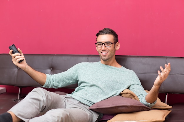 Smiling Attractive Man Enjoying Watching TV