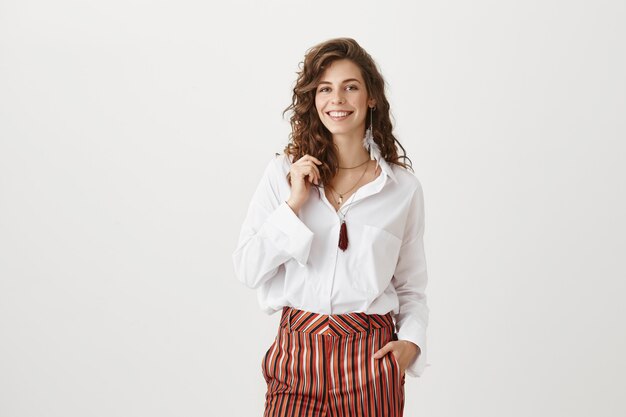 Smiling attractive woman in stylish clothes