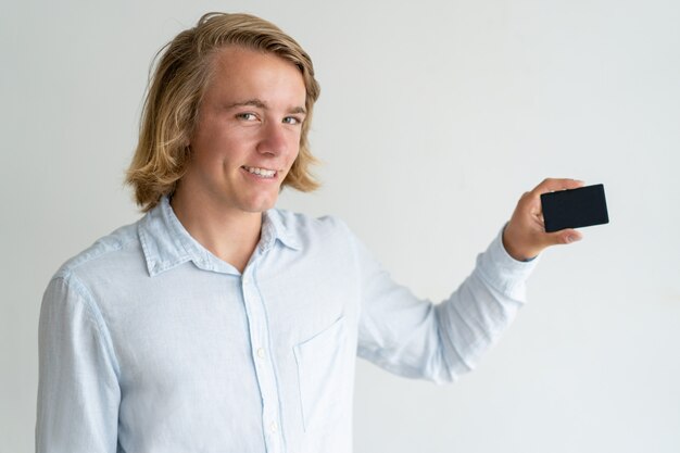 Smiling bank customer advertising credit card