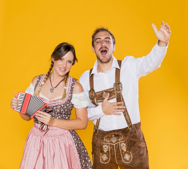 Free photo smiling bavarian friends with accordion