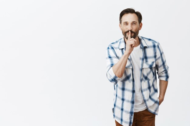 Smiling bearded mature man posing