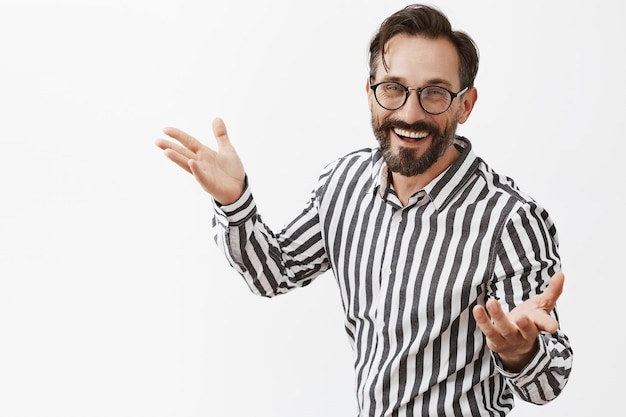 Smiling bearded mature man posing