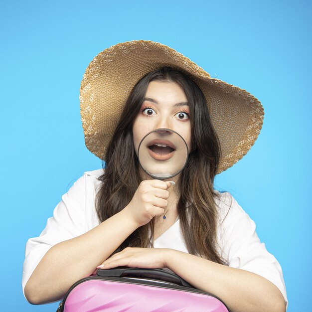 Smiling beautiful girl in hat goes on holiday wants to rest