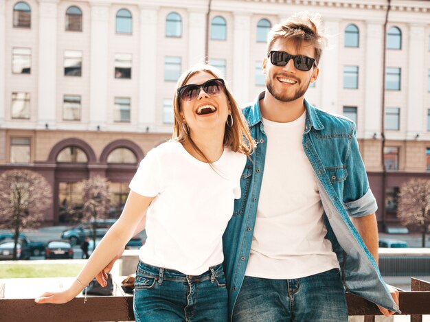 Smiling beautiful girl and her handsome boyfriend in casual summer clothes.   .