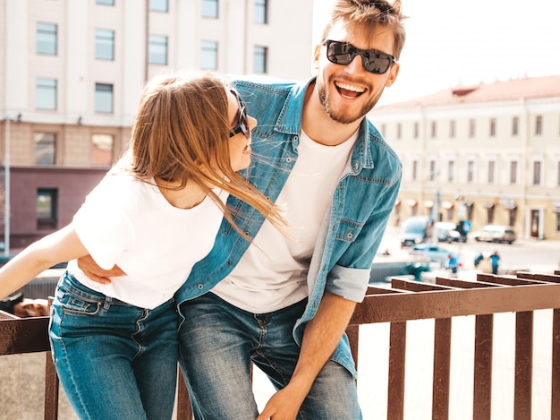 Smiling beautiful girl and her handsome boyfriend in casual summer clothes.   