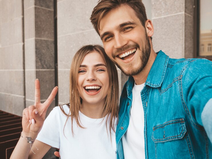 Free Photo smiling beautiful girl and her handsome boyfriend in casual summer clothes.