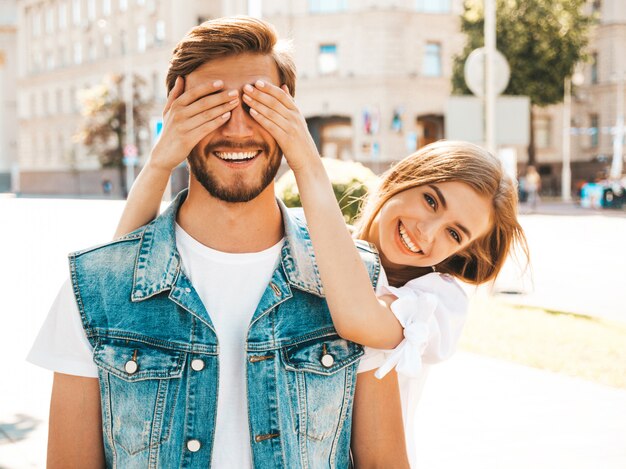 Smiling beautiful girl and her handsome hipster boyfriend.