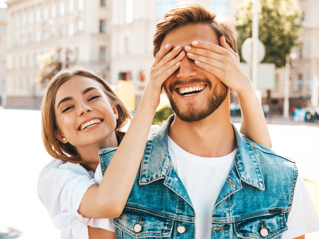 Smiling beautiful girl and her handsome hipster boyfriend.